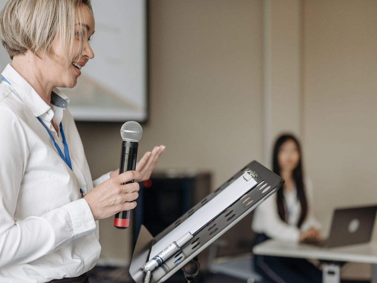 Shamaine speaking to a group with a microphone